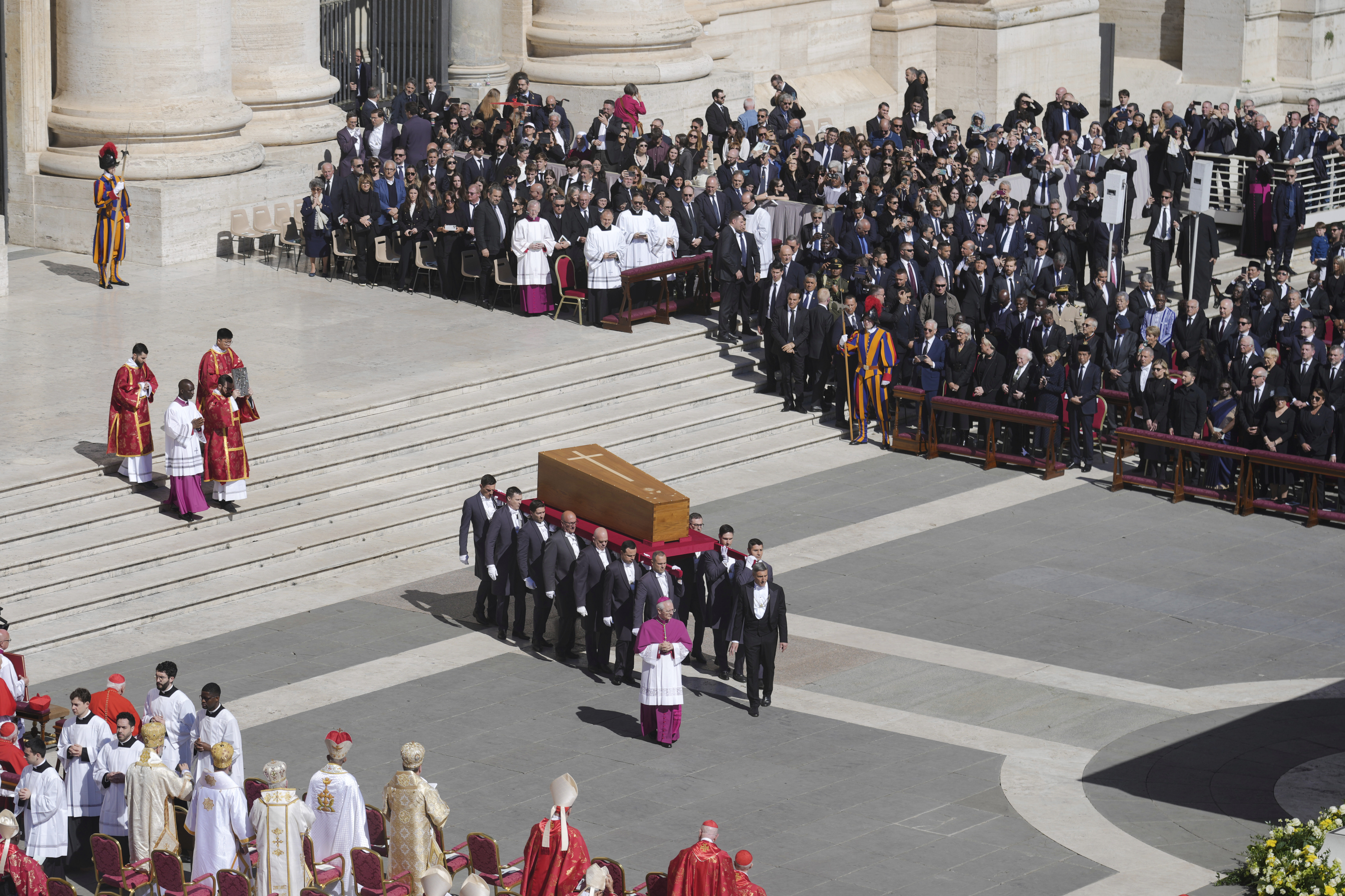 The coffin of Pope Francis is carried into St Peter's Square for his funeral, at the Vatican, Saturday, April 26, 2025. (AP Photo/Markus Schreiber)