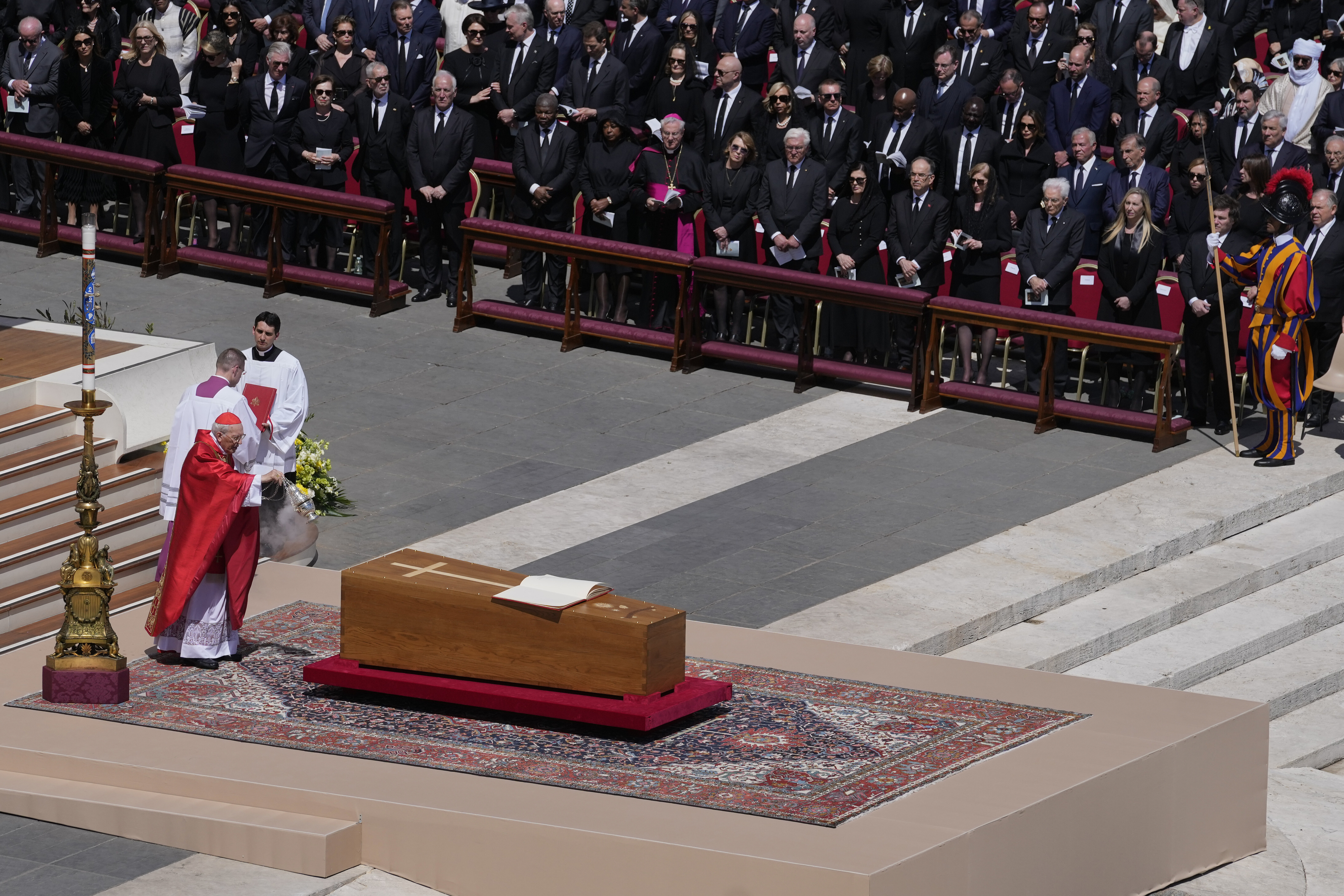 Dean of the College of Cardinals Giovanni Battista Re spreads incense around the coffin of Pope Francis during his funeral in St. Peter's Square at the Vatican, Saturday, April 26, 2025. (AP Photo/Gregorio Borgia)