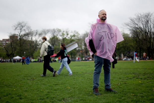 Jeffrey Schaffer join hundreds at Union Park on May 1, 2025, for the May Day march, honoring working people for International Workers' Day, before marching to Grant Park. "It's so important to be out here, Schaffer said. "The only way we're going to fight this is together." (Audrey Richardson/Chicago Tribune)