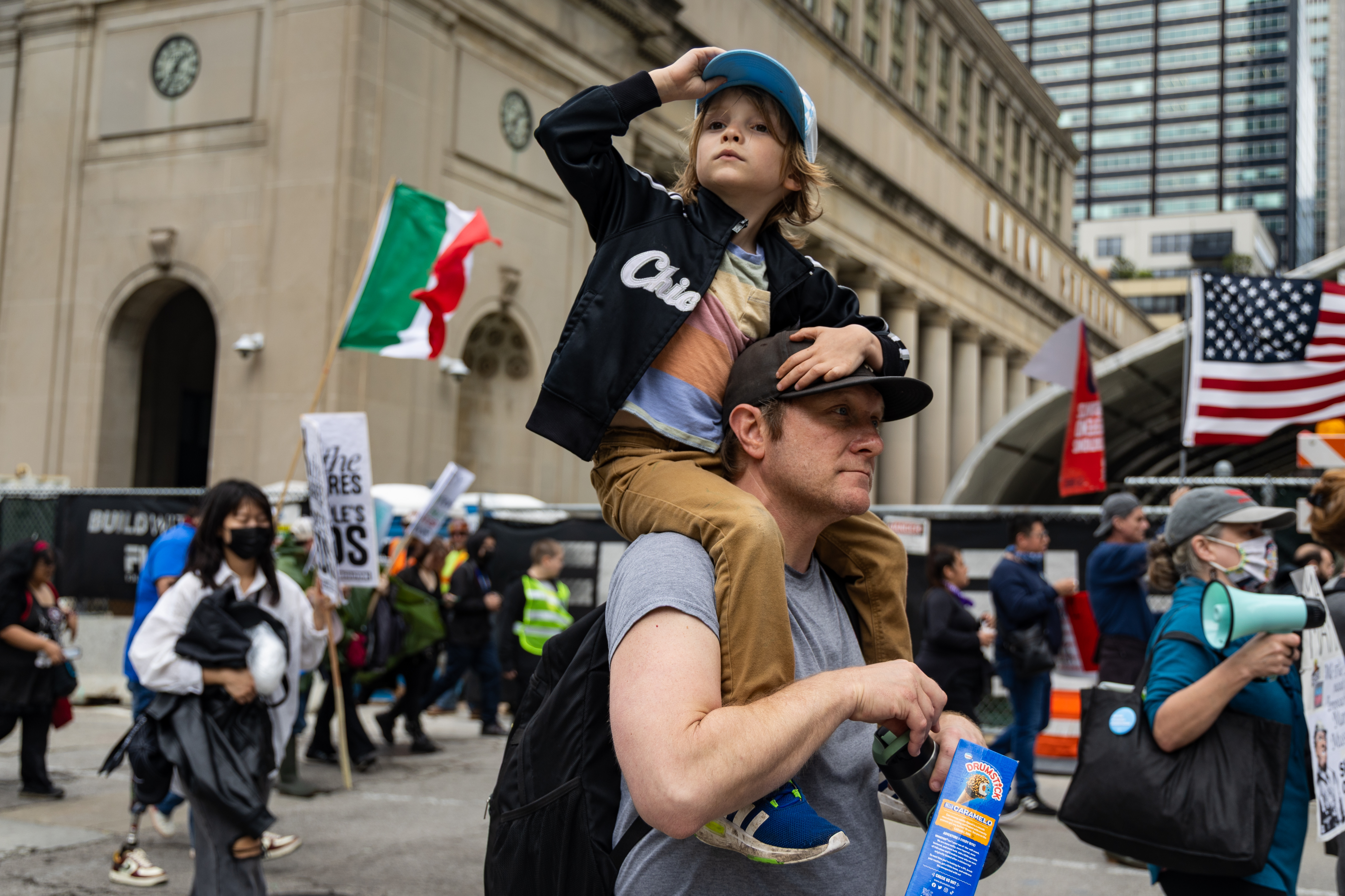 Leon Fitzgerald, 5, sits on his father, John Fitzgerald's, shoulders, as thousands march from Union Park to Grant Park for the May Day march on May 1, 2025, in Chicago. Leon was pulled out of his kindergarten class at Darwin Elementary School to participate in the march. (Audrey Richardson/Chicago Tribune)
