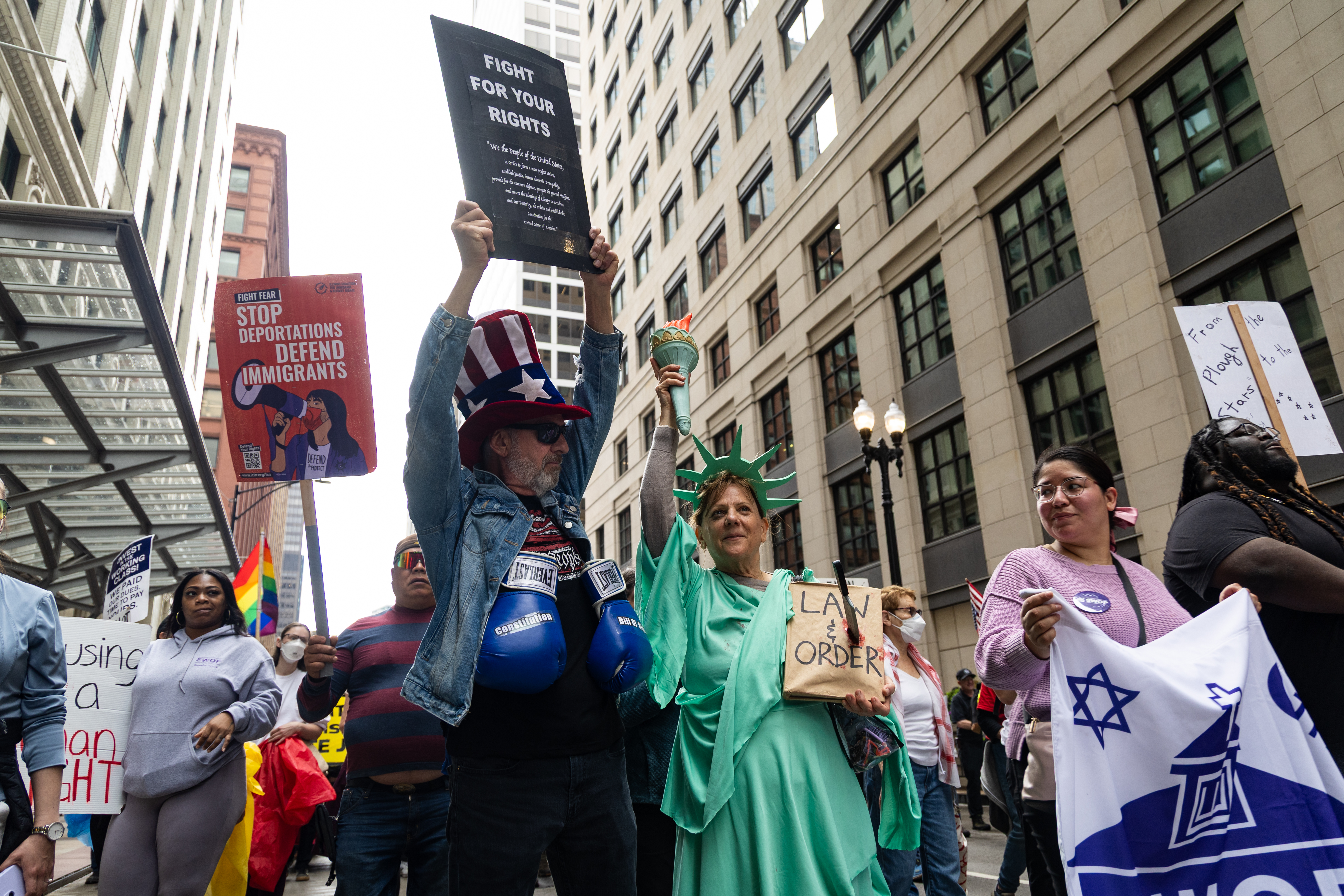 Jim Handley, center left, and Lisa Notter, march with thousands from Union Park to Grant Park for the May Day march on May 1, 2025. (Audrey Richardson/Chicago Tribune)
