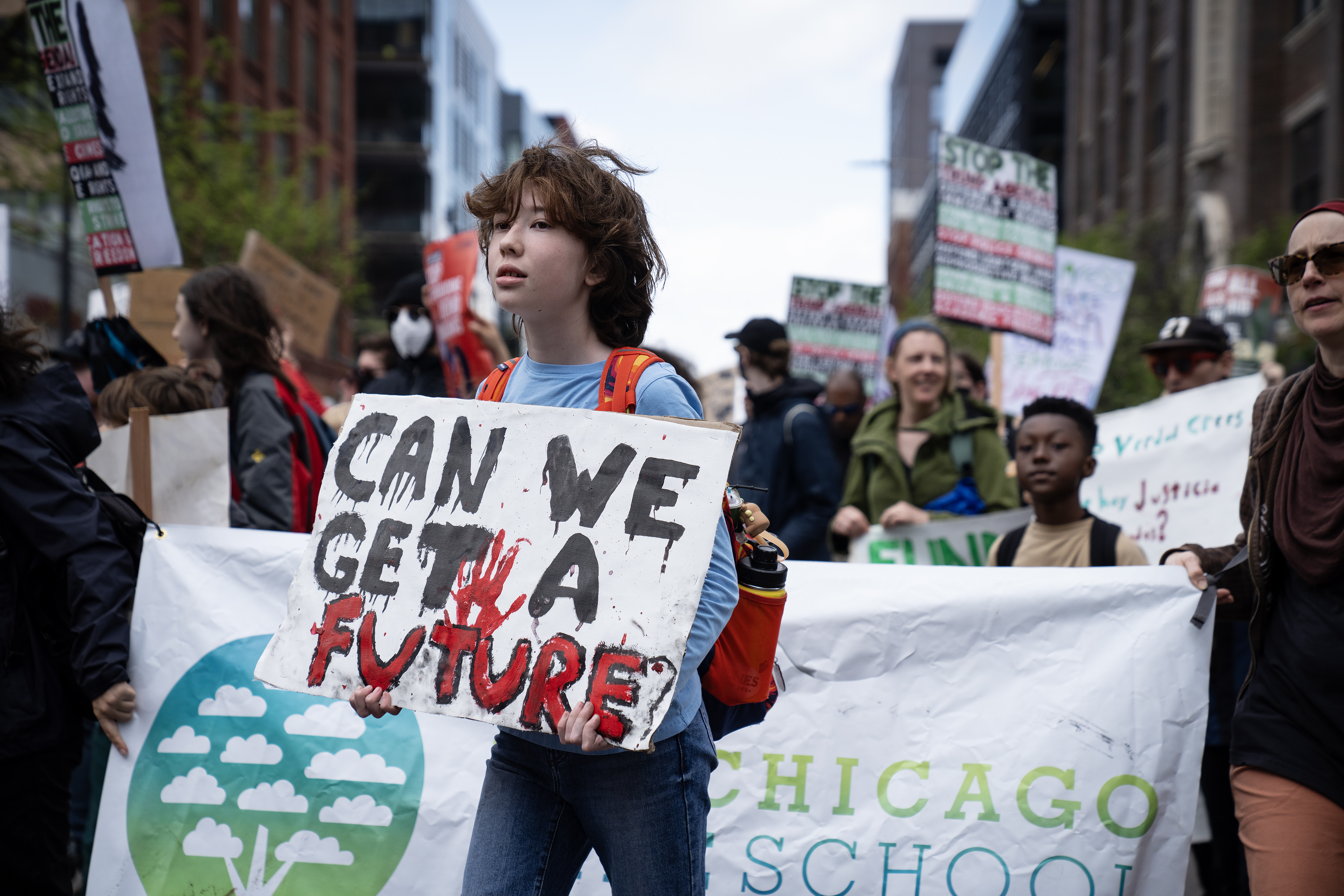 Charlotte Chung, 11, marches through the West Loop during the May Day rally and march, Thursday, May 1, 2025. (E. Jason Wambsgans/Chicago Tribune)