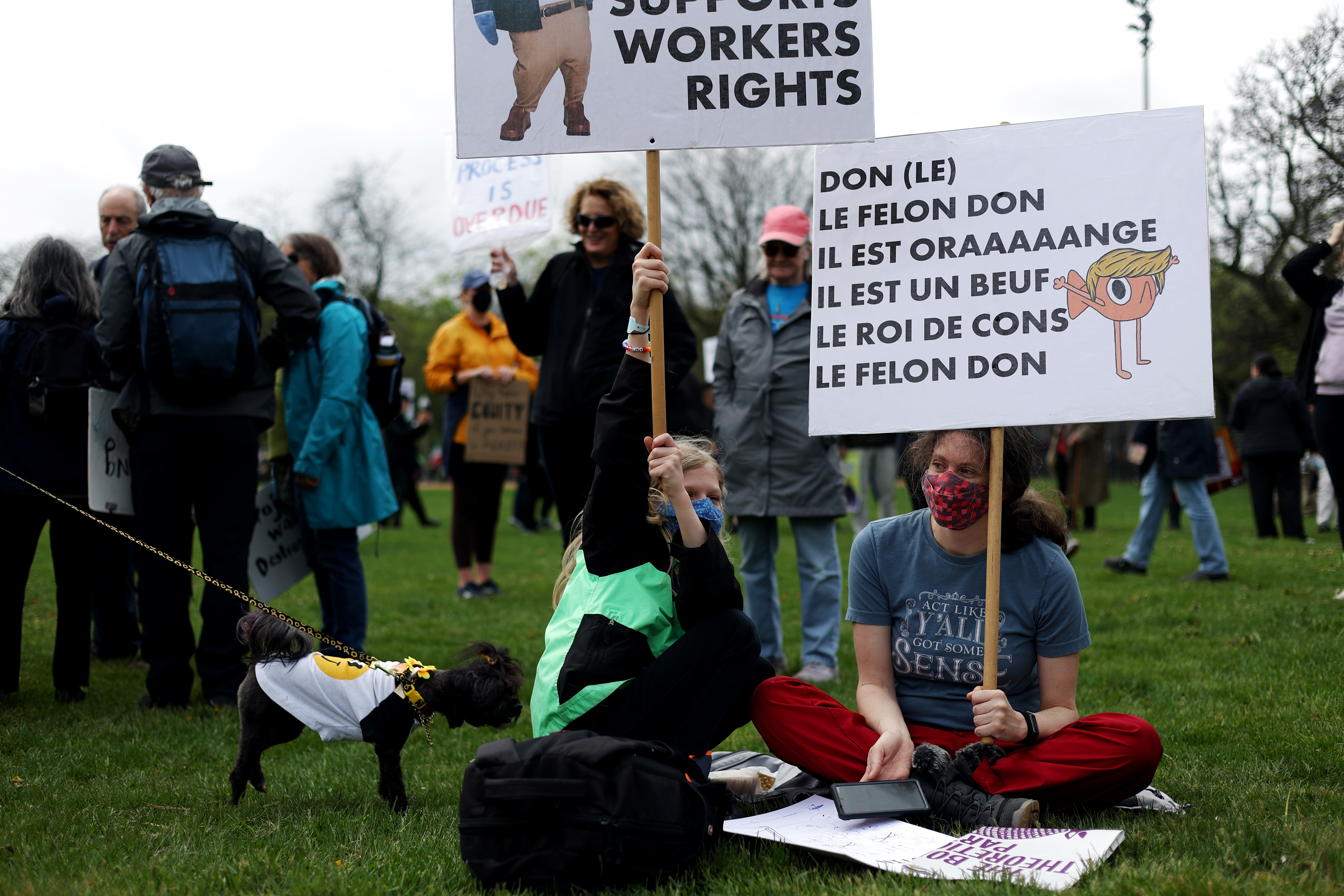 Ned Parsons, 10, left, and his mother, Kathy Parsons, gather at Union Park for the May Day march, May 1, 2025, honoring working people for International Workers' Day, before marching to Grant Park. (Audrey Richardson/Chicago Tribune)