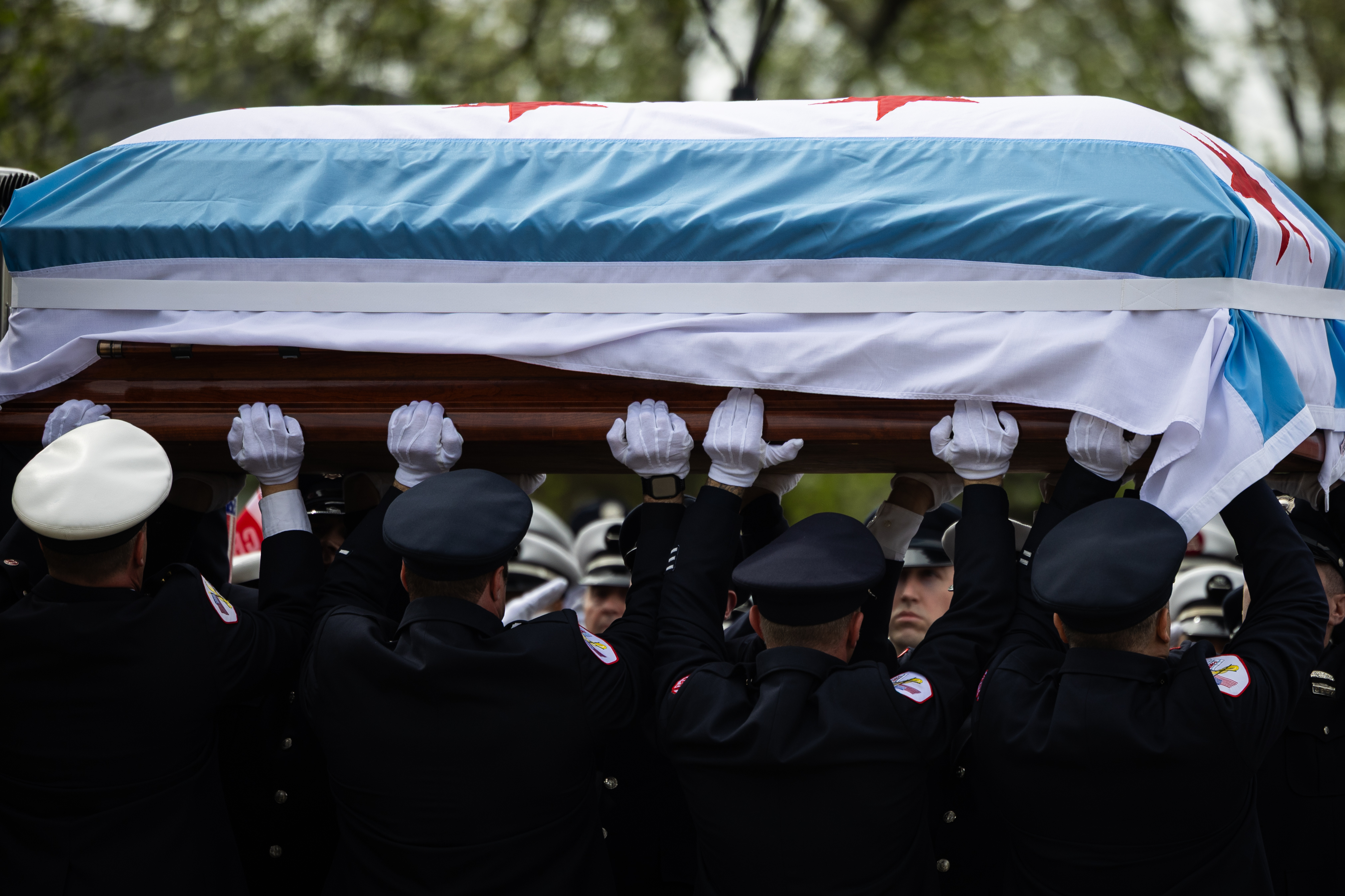 The casket of Capt. David Meyer, who died last week after responding to a West Side garage fire, is brought into St. John Brebeuf Church during a funeral service on April 29, 2025. (Audrey Richardson/Chicago Tribune)