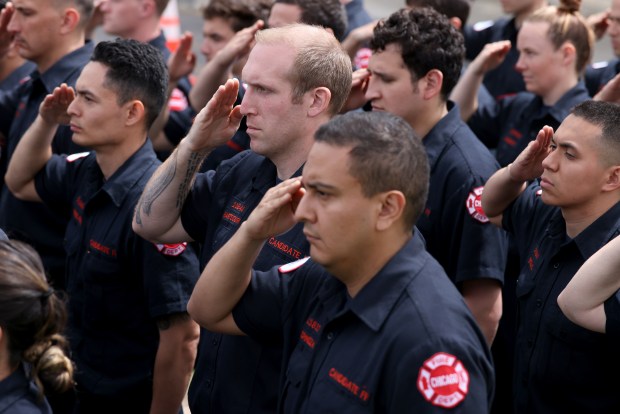 Chicago firefighter cadets salute as the casket of Chicago Fire Department Capt. David Meyer at St. John Brebeuf Church in Niles, April 29, 2025. (Antonio Perez/Chicago Tribune)
