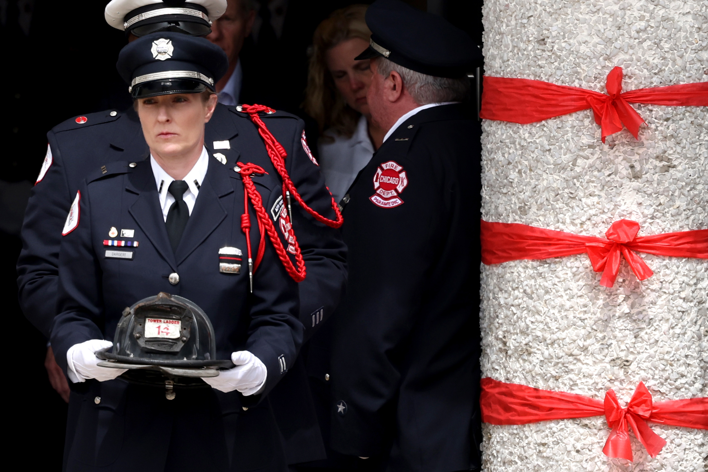 The helmet of fallen Chicago firefighter Captain David Meyer is carried out following funeral services for fallen Chicago Fire Department Capt. David Meyer at St. John Brebeuf Church in Niles, April 29, 2025. Meyer was killed in the line of duty last week battling a West Side garage fire. (Antonio Perez/Chicago Tribune)