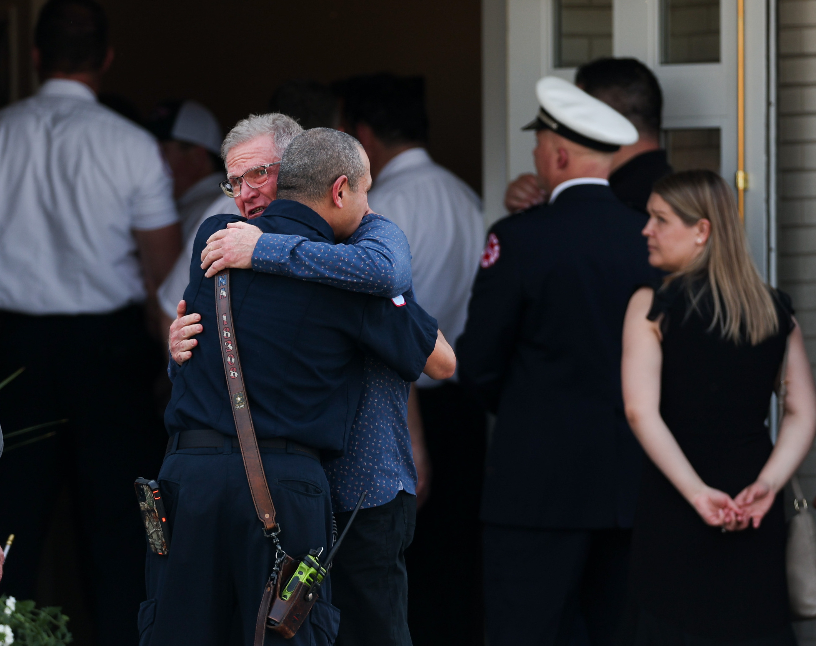 Members of the Chicago Fire Department, Police Department, family, friends and members of the community attend a wake at Malec & Sons Funeral Home on Monday for Capt. David Meyer, who died last week after responding to a West Side garage fire. (Armando L. Sanchez/Chicago Tribune)