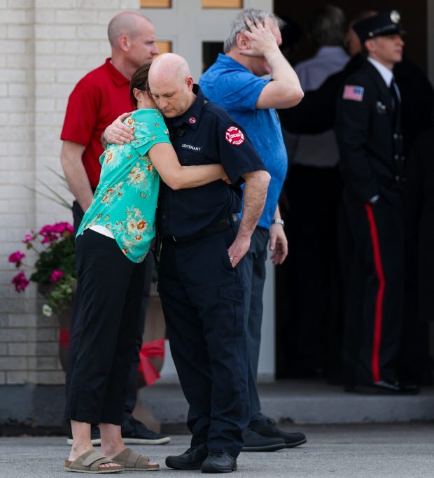 Firefighters, police officers, familyand members of the community attend a wake, April 28, 2025, at Malec & Sons Funeral Home for Chicago Fire Department Capt. David Meyer, who died last week after being fatally injured battling a West Side garage fire. (Armando L. Sanchez/Chicago Tribune)