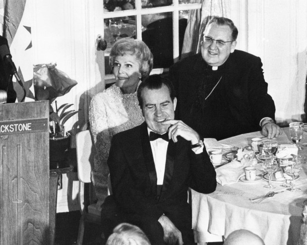 President-elect Richard M. Nixon, his wife Pat, and Cardinal John Cody listen to remarks of Gov.-elect Richard Ogilvie at a dinner held at the Sheraton-Blackstone Hotel in honor of three Chicagoans who will join the Nixon administration. State leaders of both parties attended the bi-partisan dinner hosted by insurance executive W. Clement Stone on Jan. 3, 1969. (Steve Lasker/Chicago Tribune)