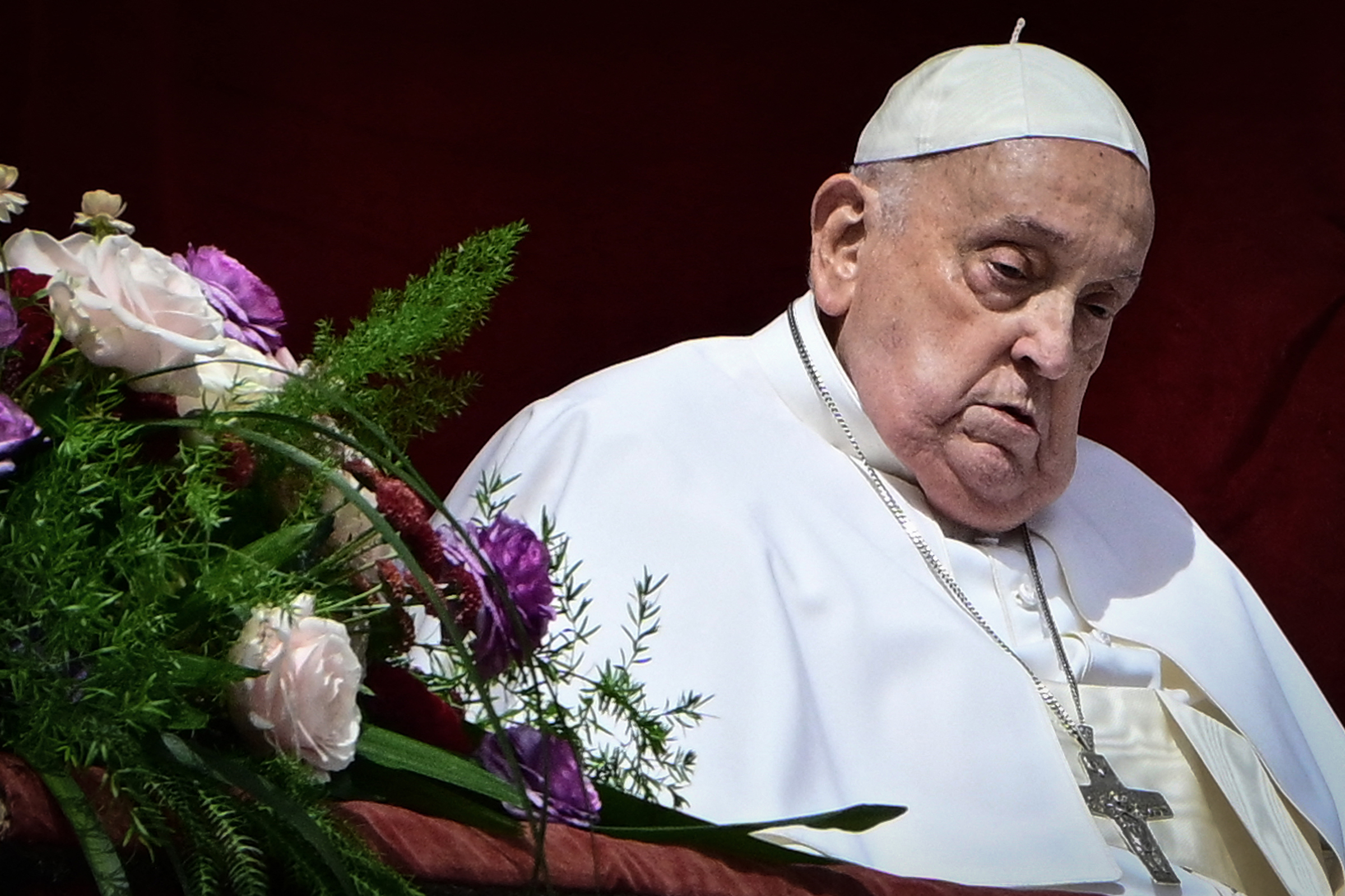 Pope Francis stands at the main balcony of St. Peter's basilica for the Urbi et Orbi message and blessing to the city and the world as part of Easter celebrations, at St Peter's square in the Vatican on April 20, 2025. (Tiziana Fabi/Getty-AFP)
